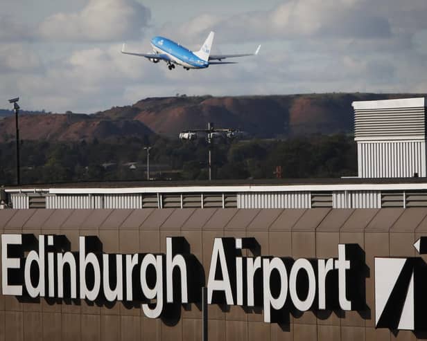 Travellers at Edinburgh Airport faced long queues last night as a result of a 'nationwide issue' which took E-gates out of action