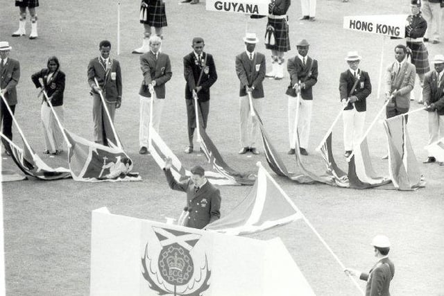 The participating countries' flags arrive in the stadium at the 1970 Opening Ceremony.