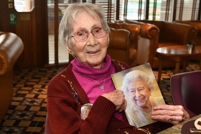 Maria Malvina Cory with her card from the Queen, on her 100th birthday
