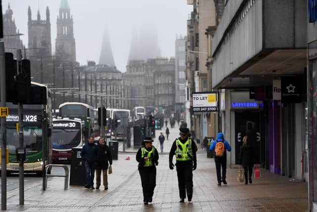 In Edinburgh, police were called to a report of a house gathering in the New Town area of the city in the early hours of Sunday, November 1. (Photo by ANDY BUCHANAN / AFP)