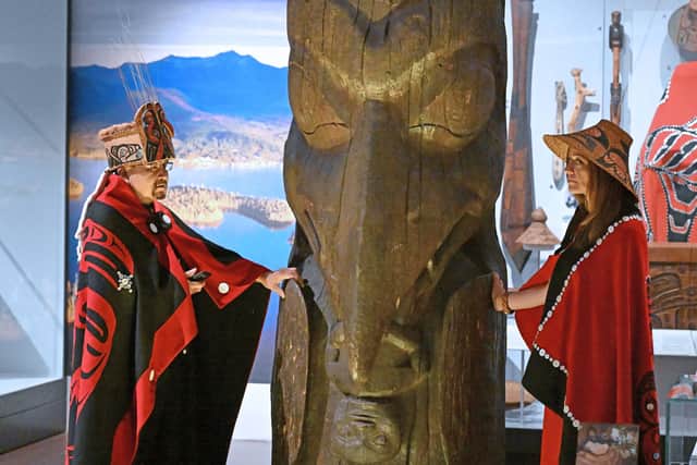 Sim’oogit Ni’isjoohl (Chief Earl Stephens) and Noxs Ts’aawit (Dr Amy Parent) stand with the House of Ni'isjoohl Memorial Pole in the National Museum of Scotland in August. Picture: Neil Hanna