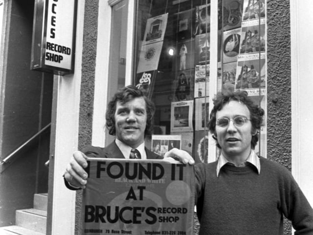 Edinburgh folk still talk about city record store Bruce's, which was the place to go for the latest tunes. Pictured are Brian Findlay and Bruce Findlay with the distinctive red carrier bag 'I Found It At Bruce's' outside Bruce's record shop in Rose Street in November 1972