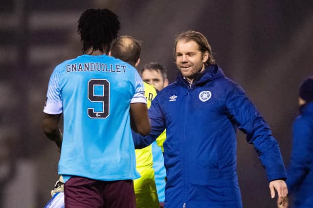 Armand Gnanduillet scored twice on his Hearts debut at Raith Rovers.