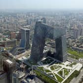 BEIJING, CHINA - AUGUST 03:  A general view shows the headquarter of China Central Television amid the Beijing skyline at central business district on August 3, 2013 in Beijing, China.  (Photo by Feng Li/Getty Images)