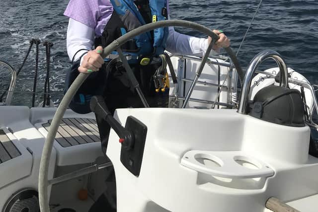 Lisa Kerr helming off the coast of Largs with the Ellen MacArthur Cancer Trust