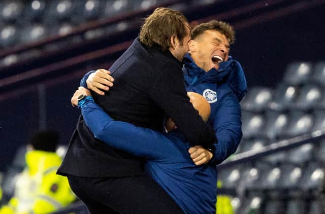 The celebrations between Hearts manager Robbie Neilson and his assistants Lee McCulloch and Gordon Forrest.