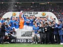 Rangers goalkeeper Allan McGregor (centre) lifts the Scottish Cup whilst his team-mates celebrate after the final whistle of the Scottish Cup final at Hampden Park, Glasgow.