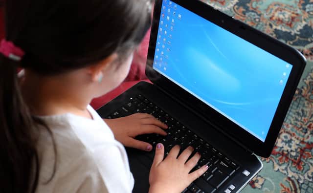 Children can be remarkably adept at using computers, with many having learned to use them from a young age (Picture: Peter Byrne/PA)