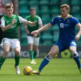 Murray Aiken, challenging St Johnstone veteran Liam Craig, was one of four Hibs youngsters thrown on at the end