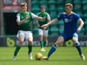 Murray Aiken, challenging St Johnstone veteran Liam Craig, was one of four Hibs youngsters thrown on at the end