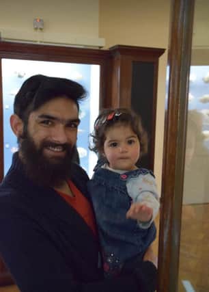 Umair Khan with his daughter Zaina as a toddler