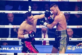 Jack Catterall lands a big left hand on Josh Taylor at the First Direct Arena in Leeds
