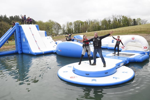 Gullane Under 11’s Football Team make a splash at Foxlake Adventures as they rise to the challenge to test the new 100m Aqua Park.  Pictured with the team are James Barbour (Director Foxlake Adventures) and Forth One’s Arlene Stewart