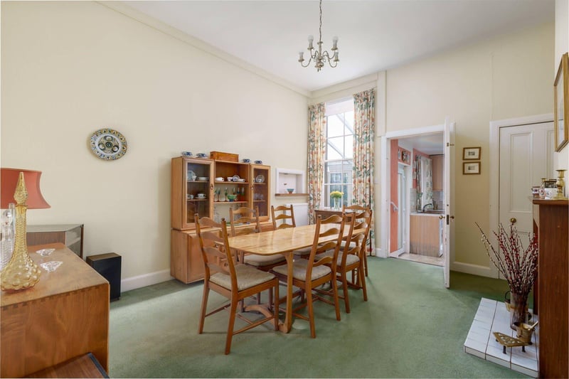 The dining room, leading to the kitchen and conservatory