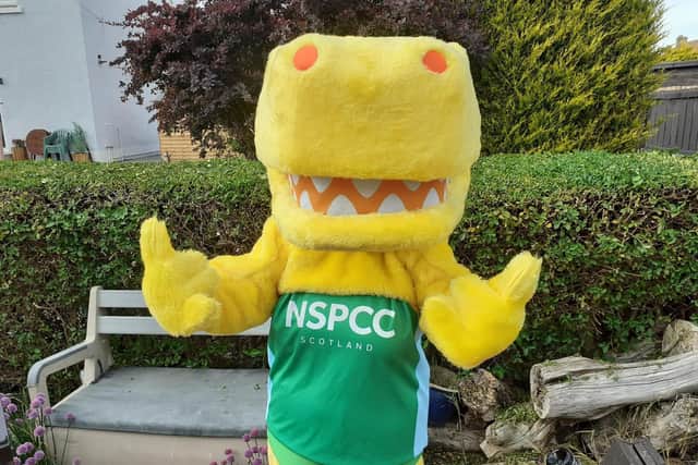Linda Hamilton, community fundraising manager for NSPCC Scotland, dressed as Pantosaurus, NSPCC’s mascot.
