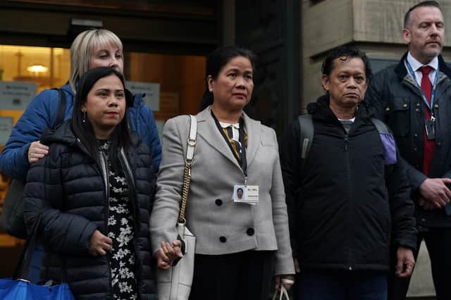 Family members of Bennylyn Burke, sister Shella Aquino (left) and father Ben Aquino (right) outside Edinburgh High Court after Andrew Innes was found guilty of the murders of Ms Burke and her two-year-old daughter, Jellica (Andrew Milligan/PA Wire)