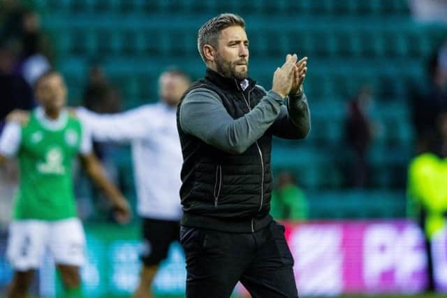 Hibs boss Lee Johnson applauds the home crowd after full-time at Easter Road. Picture: SNS