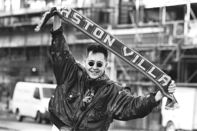 Classical violinist and Aston Villa FC fan Nigel Kennedy holding his team scarf in Edinburgh, February 1990.