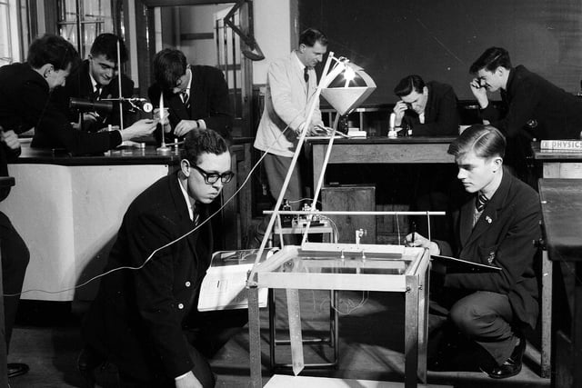 A group of sixth form boys conducting experiments on light using a ripple tank in George Watson's Boys College Science Department in April 1963.