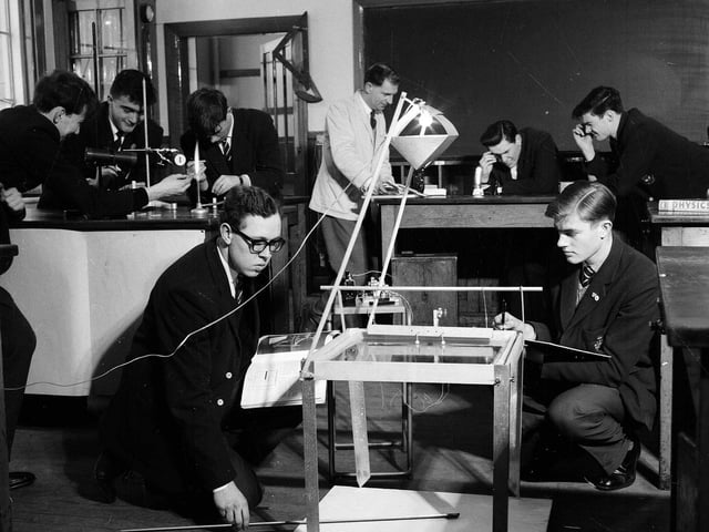 A group of sixth form boys conducting experiments on light using a ripple tank in George Watson's Boys College Science Department in April 1963.