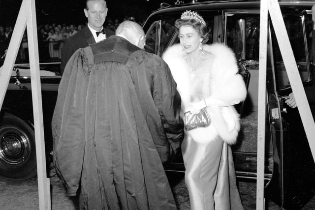 Queen Elizabeth II and Prince Philip arrive at the Royal College of Physicians, in Edinburgh, for a visit in 1966.