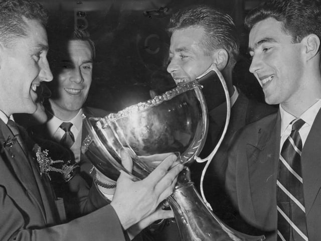 Hearts players celebrate winning the League Cup by beating Partick Thistle 5-1 in 1958. Pictured left to right are Dave MacKay, Jimmy Murray, Willie Bauld and Ian Crawford.