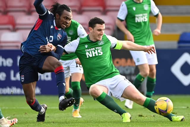 Ross County's Regan Charles-Cook fails to get the better of Hibs captain Paul Hanlon. Photo by Bill Murray / SNS Group