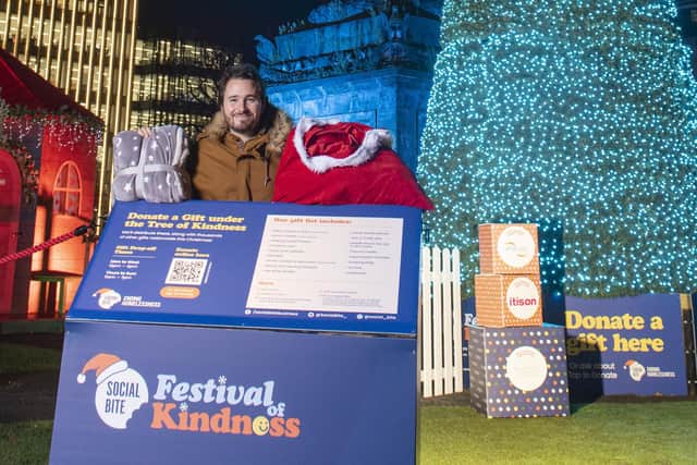 Social Bite co-founder, Josh Littlejohn at the Tree of Kindness in St Andrew Square. People can donate gifts and essential items at the 28-foot tall Christmas tree between 12pm -4pm Monday to Wednesday and 11am - 7pm Thursday to Sunday. You can also donate a virtual gift by visiting the Social Bite website