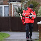 A Royal Mail delivery worker wearing a mask. Picture: PA