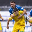 Paul McGinn holds off Kilmarnock's Greg Kiltie as Hibs' defence posted another clean sheet at Rugby Park