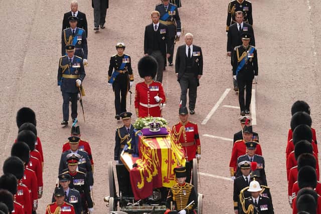 Members of the Royal Family King Charles III, the Princess Royal, the Duke of York, the Earl of Wessex, the Prince of Wales, the Duke of Sussex and Peter Phillips follow the coffin of Queen Elizabeth II, draped in the Royal Standard with the Imperial State Crown placed on top, as it is carried on a horse-drawn gun carriage of the King's Troop Royal Horse Artillery, during the ceremonial procession from Buckingham Palace to Westminster Hall, London, where it will lie in state ahead of her funeral on Monday. PA.