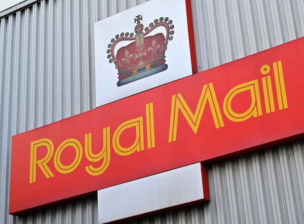 <p>A Royal Mail sign (Photo by JUSTIN TALLIS/AFP via Getty Images)</p>