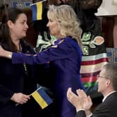Ukrainian Ambassador to the United States Oksana Markarova, left, is hugged by first lady Jill Biden as she is recognized as President Joe Biden delivers his State of the Union address to a joint session of Congress at the Capitoll. Picture, Win McNamee, Pool via AP
