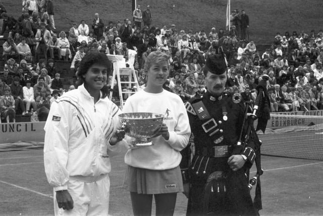 Gabriela Sabatini and Lisa Bonder share the trophy at the Scottish grasscourt championship at Craiglockhart Lawn Tennis Club in June 1987.