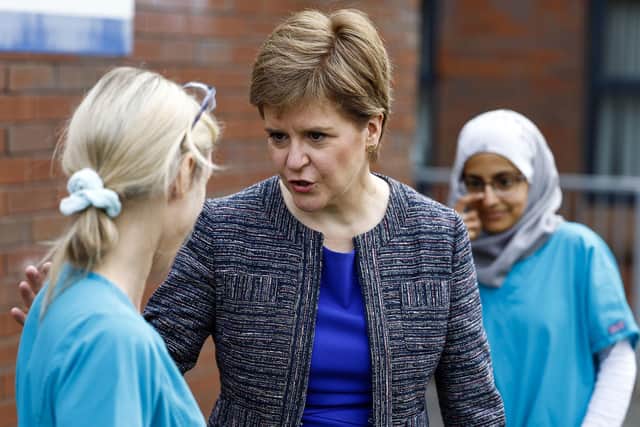 First Minister Nicola Sturgeon meets staff during a visit to the Forge Medical Centre in Parkhead, Glasgow. Picture: Jeff J Mitchell/PA Wire