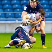 Hamish Watson, top, gets to grips with Glasgow's Huw Jones during Edinburgh's 1872 Cup win on Saturday. Picture: Ross Parker/SNS