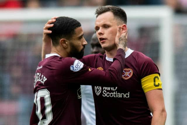 Josh Ginnelly (left) and Lawrence Shankland congratulate each other as the strike-pairing combined for five goals in the 6-1 win over Ross County. Picture: SNS
