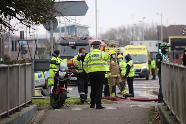 Police and fire crews wait at the scene of the house fire. Picture: Habibur Rahman