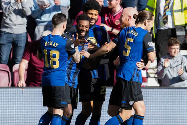 Beni Baningime celebrates with his Hearts team-mates after putting the Jam Tarts 1-0 in front. Picture: SNS