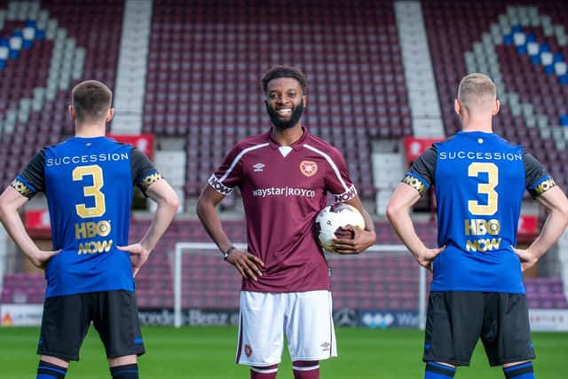 Players Ben Woodburn, Stephen Kingsley, and Beni Baningime pose with the limited edition football shirts. Photo: Sandy Young/PinPep.