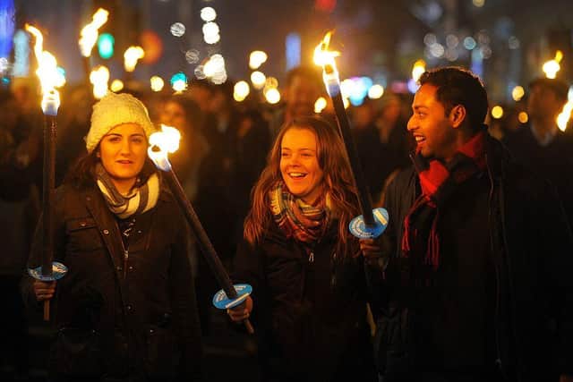 Members of the public take part in a torchlight procession through the streets of Edinburgh in Scotland on December 30, 2016, as the city begins to celebrate Hogmanay. Picutre ANDY BUCHANAN/AFP via Getty Images