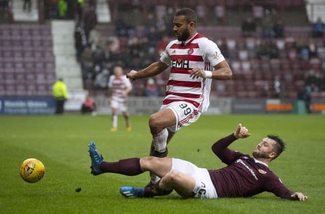 Hearts defender Craig Halkett challenges Marios Ogkmpoe during the 2-2 draw against Hamilton Accies in February 2020. Picture: SNS