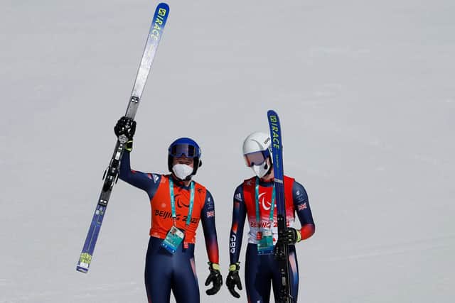 Neil Simpson celebrates Great Britain's first ever male Paralympic gold on snow with guide and brother Andrew Simpson. (Photo by Christian Petersen/Getty Images)