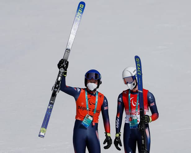 Neil Simpson celebrates Great Britain's first ever male Paralympic gold on snow with guide and brother Andrew Simpson. (Photo by Christian Petersen/Getty Images)