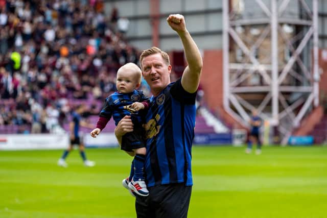 Hearts legend Gary Locke takes the acclaim before his testimonial match against Stoke City.