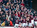 Hearts players and fans celebrate against Celtic. Picture: SNS