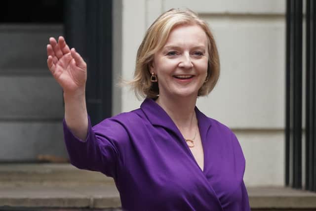 Liz Truss waves outside Conservative Campaign Headquarters in London yesterday following her victory in the Tory leadership race. Picture: Victoria Jones/PA Wire