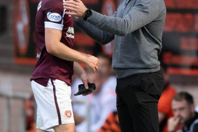 DUNDEE, SCOTLAND - AUGUST 28: Hearts manager Robbie Neilson with Ben Woodburn as he leaves the field during a cinch Premiership match between Dundee United and Hearts at Tannadice, on August 28, 2021, in Dundee, Scotland (Photo by Mark Scates / SNS Group)