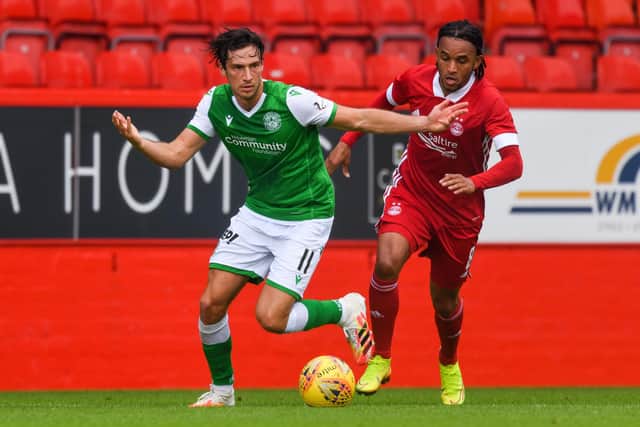 Joe Newell and Funso Ojo in action during a pre-season friendly match between Aberdeen and Hibernian at Pittodrie in July.