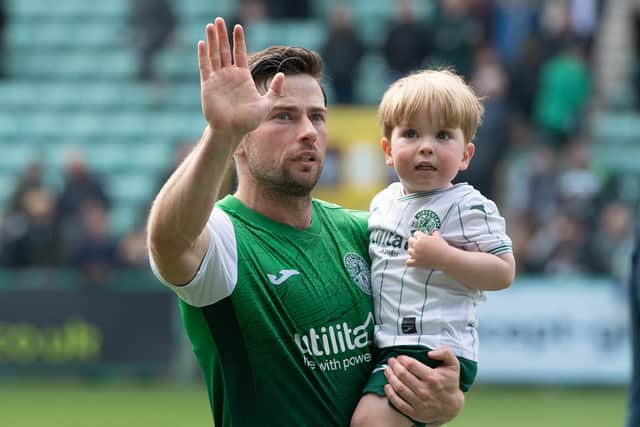 Lewis Stevenson and his young son salute the Hibs fans at the end of a challenging season
